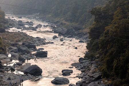 River flowing through a gorge in the mountains during sunset