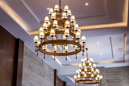 Lamp style chandelier hanging by the ceiling inside house