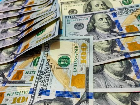 Close up of new and old american hundred dollar bills bank notes background