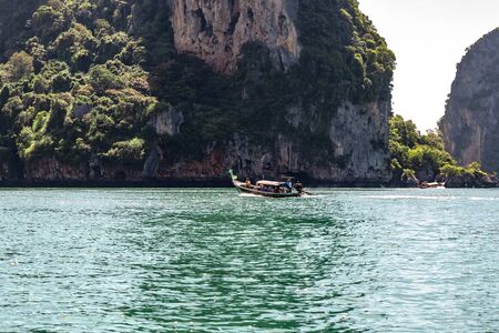 Krabi Town, Thailand - November 23 2019: Tourists sailing in Longtail Boat in Andaman sea off the coast of Thailand.のeditorial素材