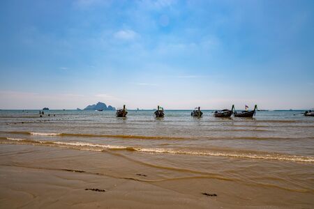 Krabi Town, Thailand - November 23 2019: Traditional Longtail boats parked at Ao Nang Beach in Krabi, Thailand.のeditorial素材