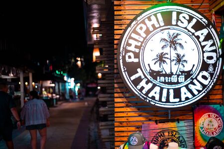 Phi Phi Island, Thailand - November 24 2019: Colorful print with Phi Phi Island text written outside a clothing store in Phi Phi Islands, Thailand.のeditorial素材