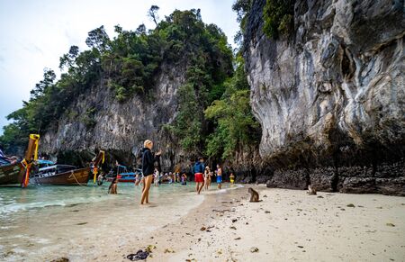 Phi Phi Island, Thailand - November 24 2019: Tourists enjoying their visit to the Monkey Beach on Phi Phi Island. Monkey beach is about 5 minutes boat ride from the pier.のeditorial素材