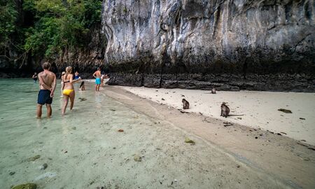 Phi Phi Island, Thailand - November 24 2019: Tourists enjoying their visit to the Monkey Beach on Phi Phi Island. Monkey beach is about 5 minutes boat ride from the pier.のeditorial素材