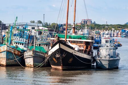 Phuket, Thailand - November 26 2019: Cargo and passenger ships parked at Rassada Harbour in Phuket pier.のeditorial素材