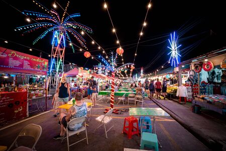 Phuket, Thailand - November 26 2019: People enjoying local delicacies at a Night market in Phuket near Patong beach area.のeditorial素材
