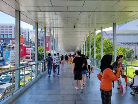 Bangkok, Thailand - November 29 2019: Crowd of pedestrian bustling away on a busy day on the Ratchaprasong District R Walk elevated pedestrian walkway.のeditorial素材