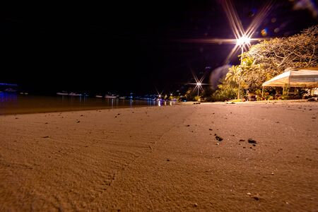 Night view of Loh Dalum Beach in Phi Phi Islands, Thailand. Sea and lights.の写真素材
