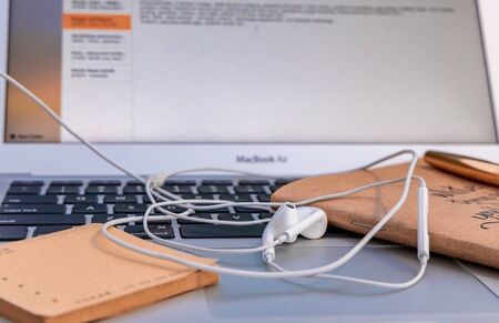 Blogger concept. There is a pc laptop with notebook and pen placed outdoor. selective focus.の写真素材