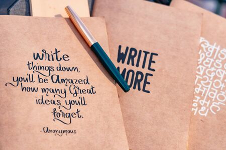 Notebooks with great quotes placed next to each other. selective focusの写真素材