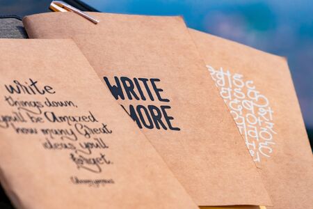 Notebooks with great quotes placed next to each other. selective focus