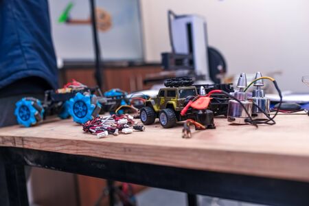 Desk of a hardware engineer. Electronic components scattered on the desk. Work Desk of a passionate programmerの写真素材