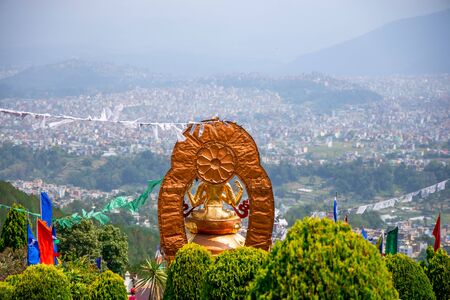 Golden Status of Buddha looking over Kathmandu valley. selective focusの写真素材
