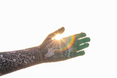 Hands of woman with detailed henna design artの写真素材