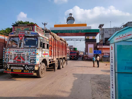 Belahiya, Nepal - July 26 2020: PAN Empty Cargo Trucks cross Nepalese Border into India during Coronavirus Pandemic. The cargo trucks are allowed to move freely between two countries amid lockdown.のeditorial素材