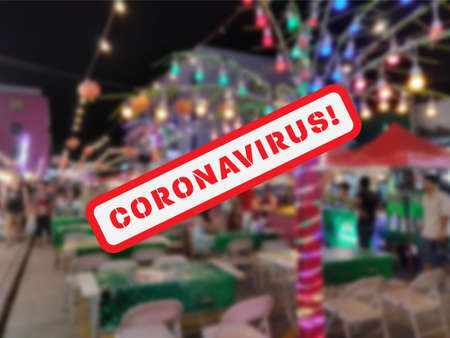 Blurred Nightlife in Thailand with Coronavirus text in the foreground. Impact of coronavirus on the night market and nightlife of Asian cities.の写真素材