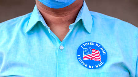 Man puts I Voted By Mail stickerの写真素材