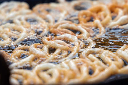 Fresh Jalebi Sweet Snack outdoors in a bazaar.