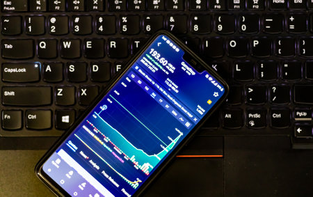 Kathmandu, Nepal - January 29 2021: Stock trading app on phone shows stock price of GME against GameStop logo.のeditorial素材