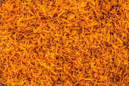 Turmeric roots closeup. Fresh harvest of many turmeric roots background texture.の写真素材
