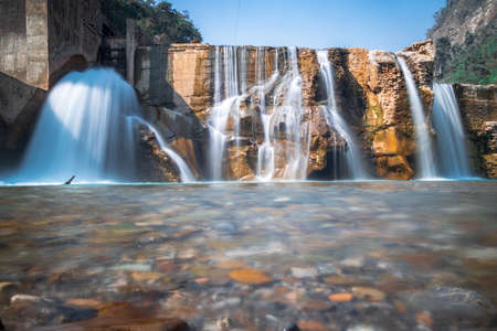 Smooth Long Exposure of Waterfall. Creamy Beautiful waterfall falling off a cliff in the mountas.の写真素材