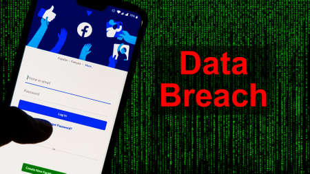 Facebook App aginst Leak text in red and Matrix-style green background. 533 Million Facebook User's personal information has been leaked online on Saturdayのeditorial素材