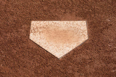 A close up of home plate on a baseball diamond.の写真素材