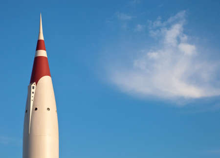 A close up of a retro 1950's rocket with a blue sky background.の写真素材