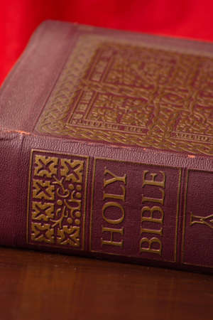 A close up of a bible with a red background.の写真素材