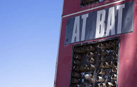 A close up of a baseball scoreboard, showing the word at bat.の写真素材