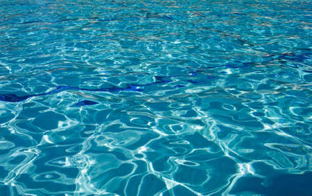 A shot of a clear blue swimming pool.