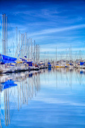 A shot of a bunch of boats in dry dock in a Long Beach harbor.の写真素材