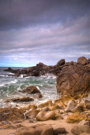 A shot of an early morning Corona Beach in Newport Beach California with the surf crashing into...