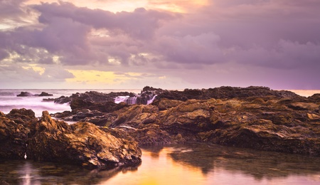 A sunset shot  looking out to the Pacific Ocean after a storm in Newport Beach.