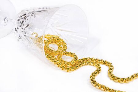 golden necklace in crystal glass on white background 