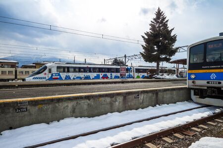 KAWAGUCHIKO, JAPAN - 9 Feb. 2016 The special local train painted Mt. Fuji on its wagon is parking on the platform at Kawaguchiko station. The station is famous for scenery of Mt. Fuji.のeditorial素材