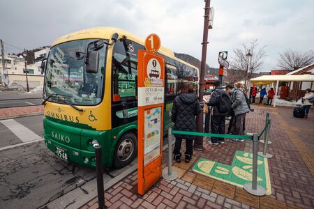 FUJIKAWAGUCHIKO, JAPAN - February 9, 2016: Local Sight Seeing Bus parking for tourist at the Kawaguchiko station.のeditorial素材