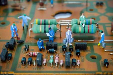 Miniature technicians peoples on circuit board