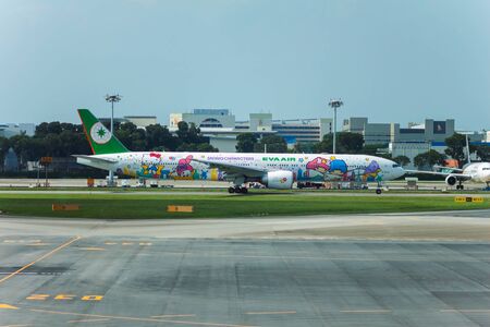 SINGAPORE - AUG. 8 ,2016 : EVA AIR Boeing 777-36N ER ( Hello Kitty Shining Star Livery ) landing in Changi airport, Singapore.One of the most adorable Sanrio Character special livery on the flagship of Eva Air.のeditorial素材