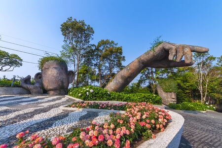 Da Nang, Vietnam - Mar. 29, 2019: Giants sculpture in the garden on Ba Na Hills french village, Ba Na Hills mountain resort is a favorite destination for tourists.のeditorial素材