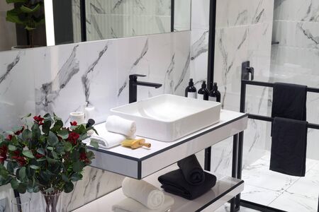 A modern style bathroom with basin in a black and white tone colored.の写真素材