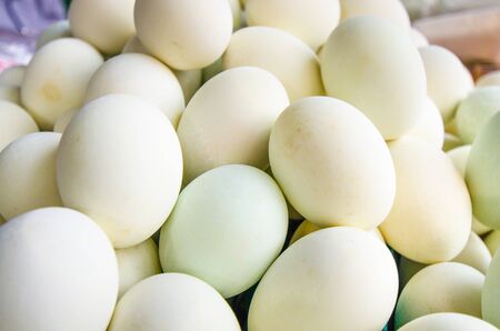 Many white eggs at the street marketの写真素材