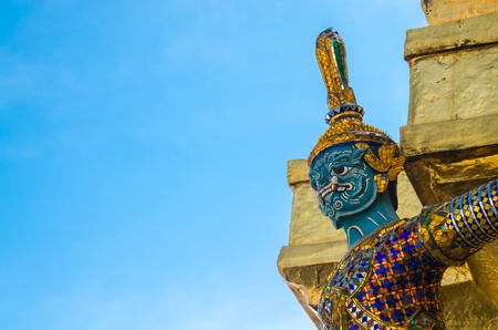 Giant statue in emerald temple with blue sky の写真素材