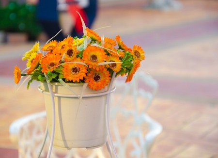 Plastic flower on the white table.の写真素材