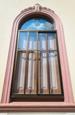 Window on the wall of church in thailand.の写真素材