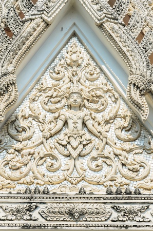 Tradition thai stone at the wall of temple.の写真素材