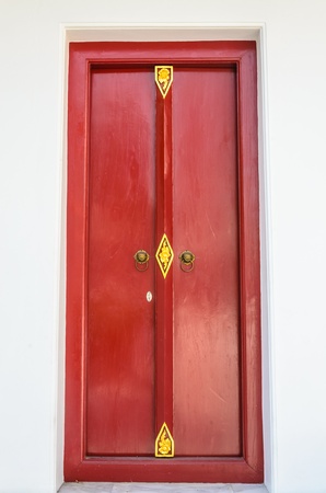 Red door at the temple of thai.の写真素材