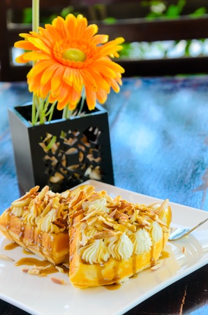 Caramel waffle on the wood table.の写真素材