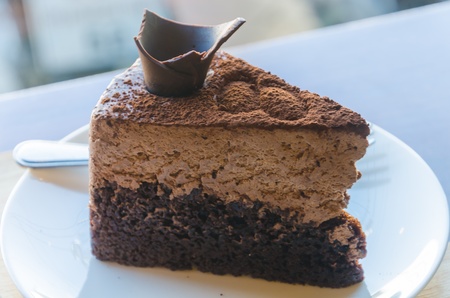 Chocolate cake on the table at coffee shop.