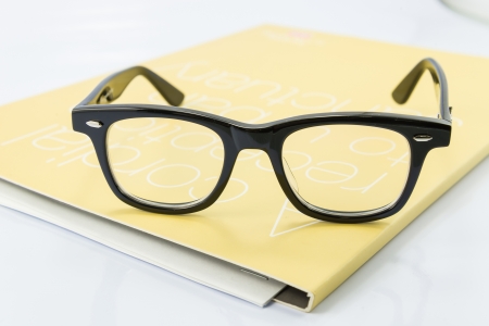 Glasses on the bookの写真素材